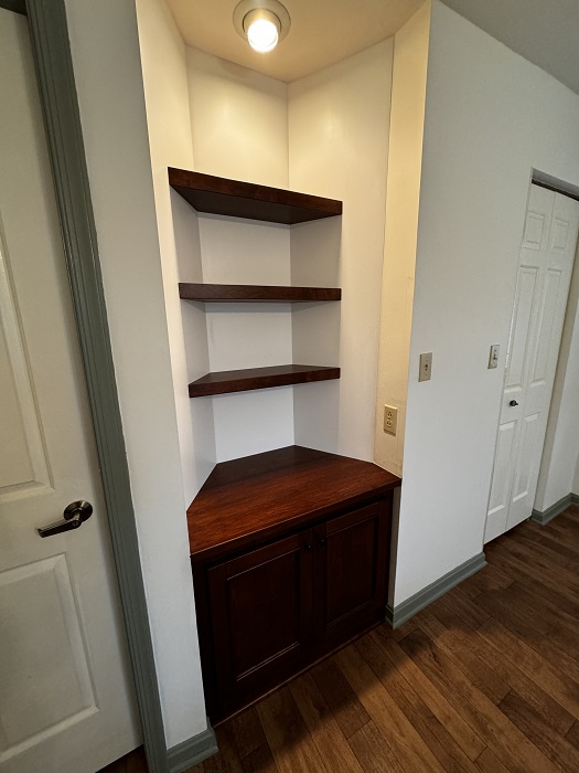 Custom cabinet built to fit wall niche